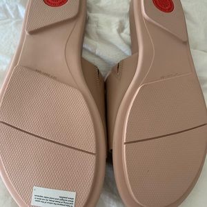Womans fitflop brand new/ too wide for my med foot. Size 9. Paid $95.
